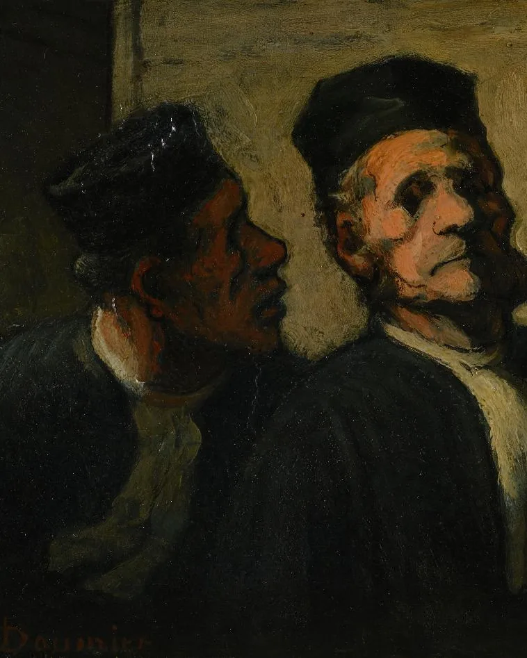 Two lawyers in black robes conferring against an ochre wall